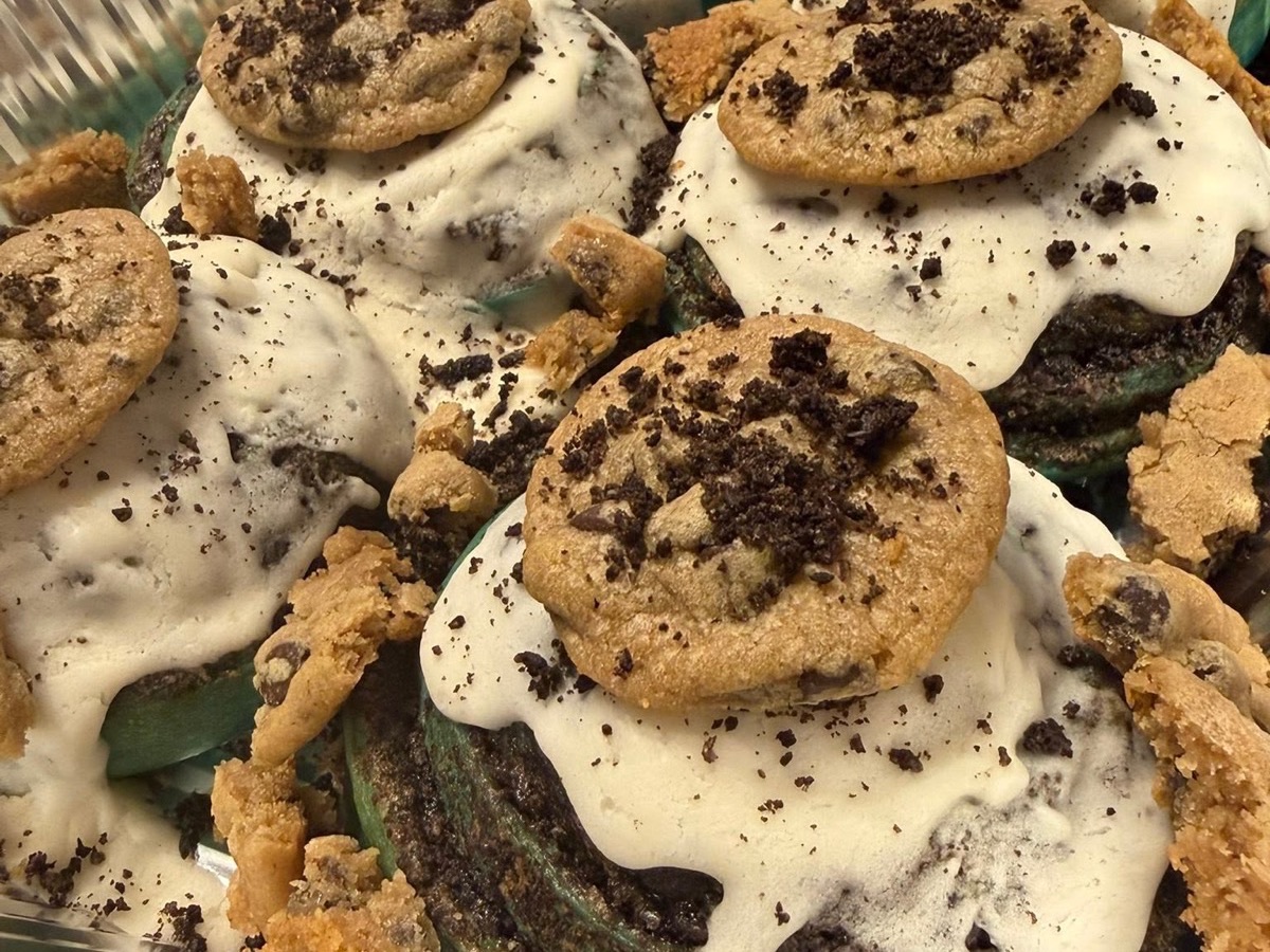 Chocolate cupcakes topped with mini cookies and crumbles