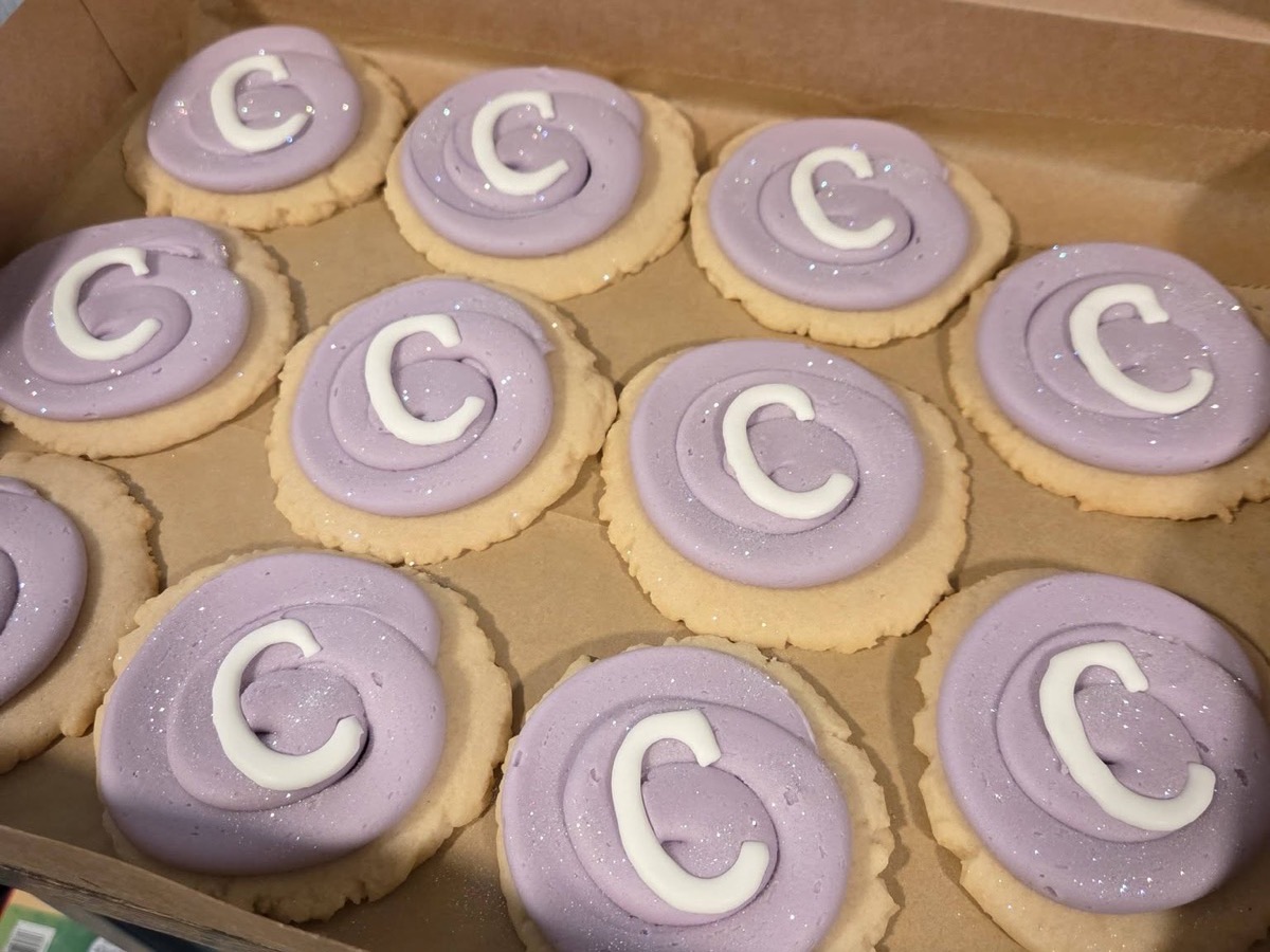 Purple frosted sugar cookies decorated with the letter C
